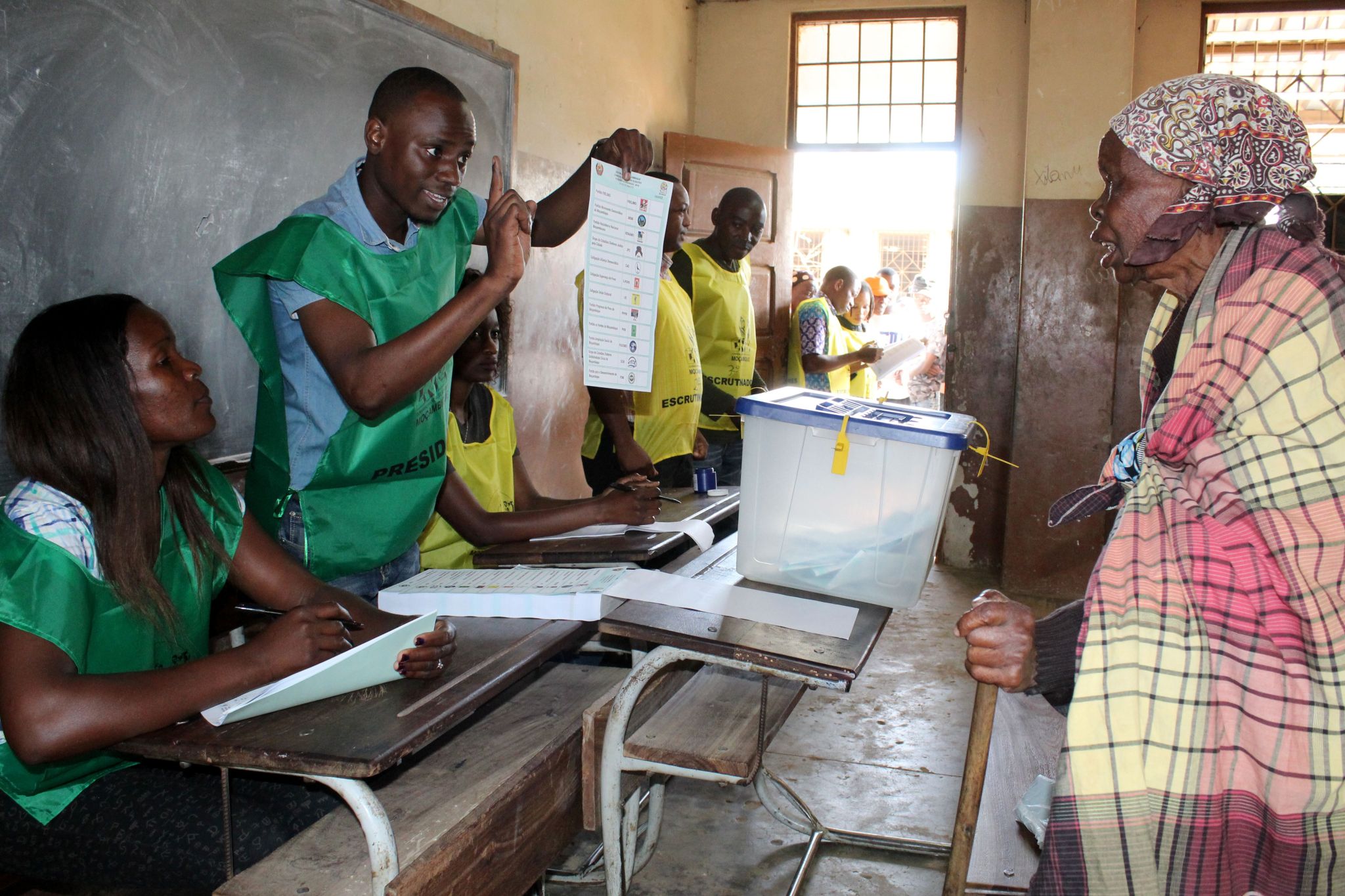 A woman prepares to cast her ballot