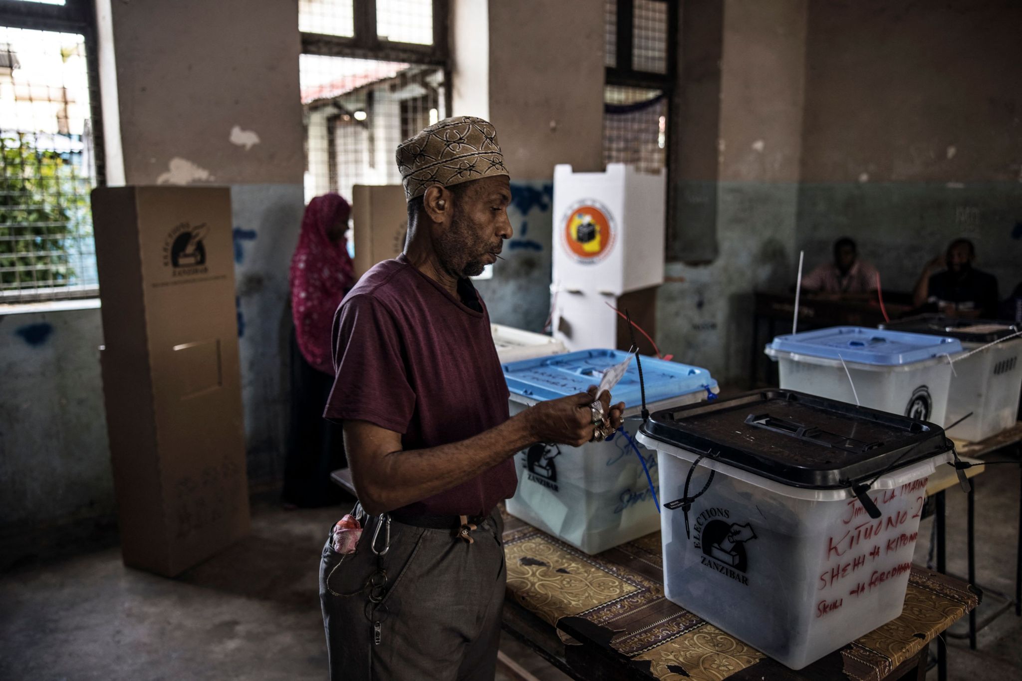 A man prepares to cast his ballot at a polling station