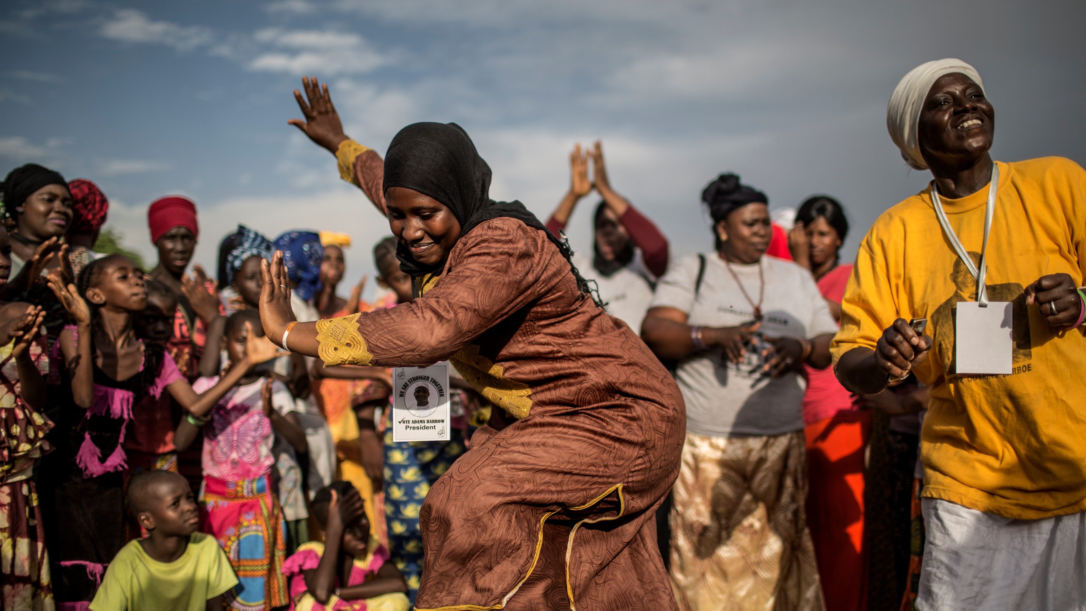 Gambians dancing at political rally