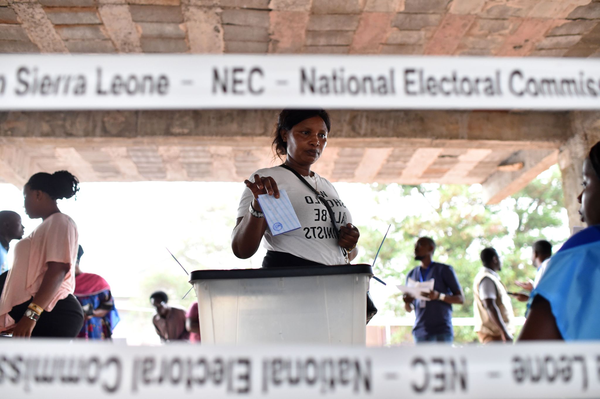 A woman casts her vote at a polling station in Sierra Leone