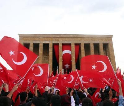 People waving Turkish flag